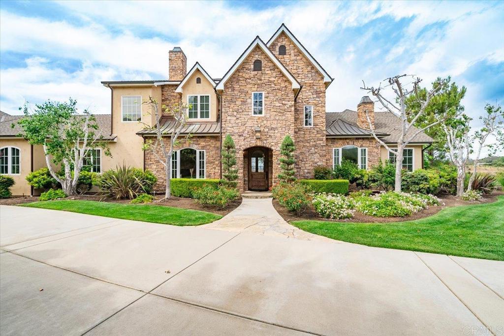 32110 Dos Ninas Bonsall, CA 92003 - Photo 2 of 75 a front view of a house with garden