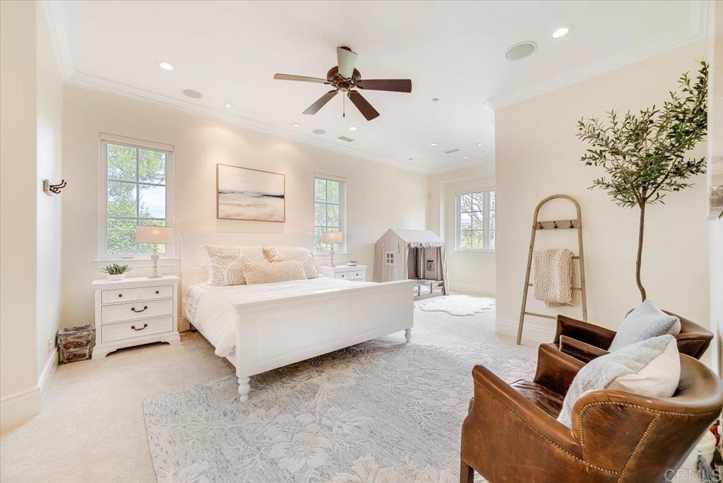 32110 Dos Ninas Bonsall, CA 92003 - Photo 23 of 75 a living room with furniture and a chandelier