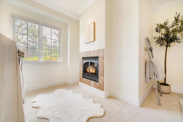 a bathroom with a granite countertop sink mirror vanity bathtub and toilet