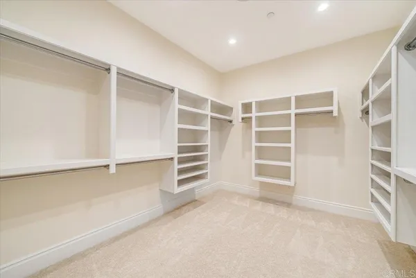 a bed room with a bed and a chandelier