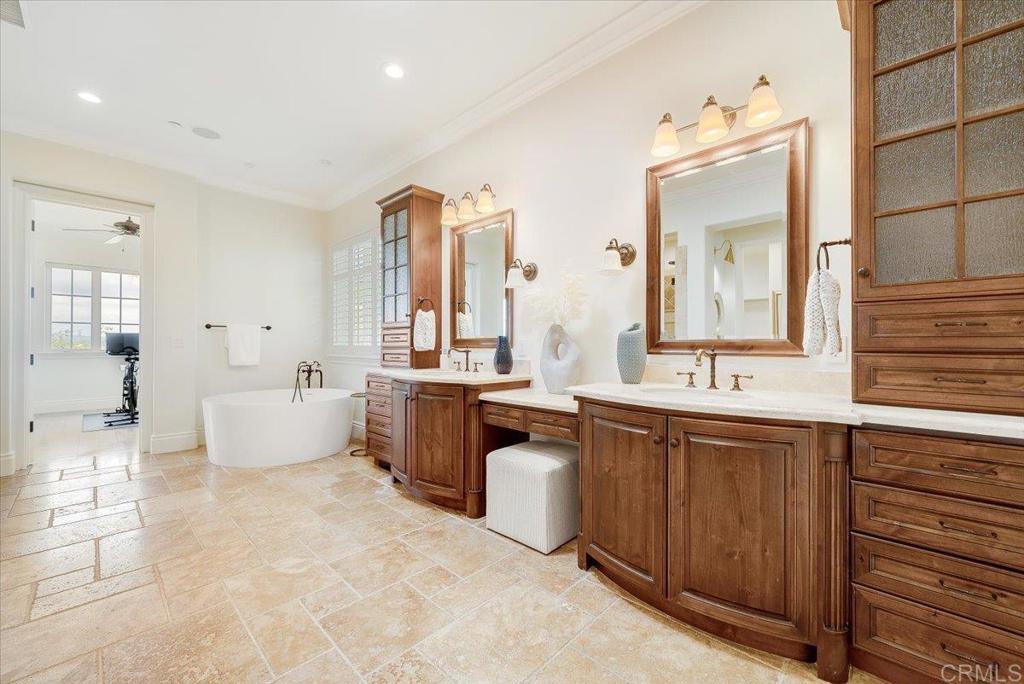 32110 Dos Ninas Bonsall, CA 92003 - Photo 29 of 75 a large bathroom with a large tub sink and mirror
