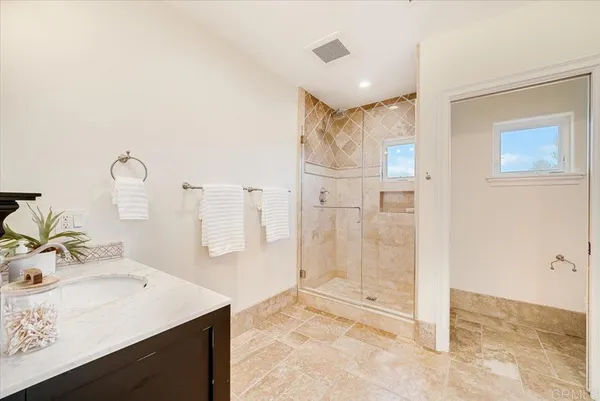 a utility room with sink dryer and washer