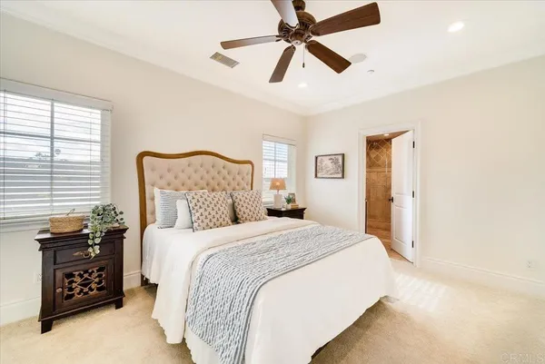 a view of a patio with table and chairs with wooden floor and fence