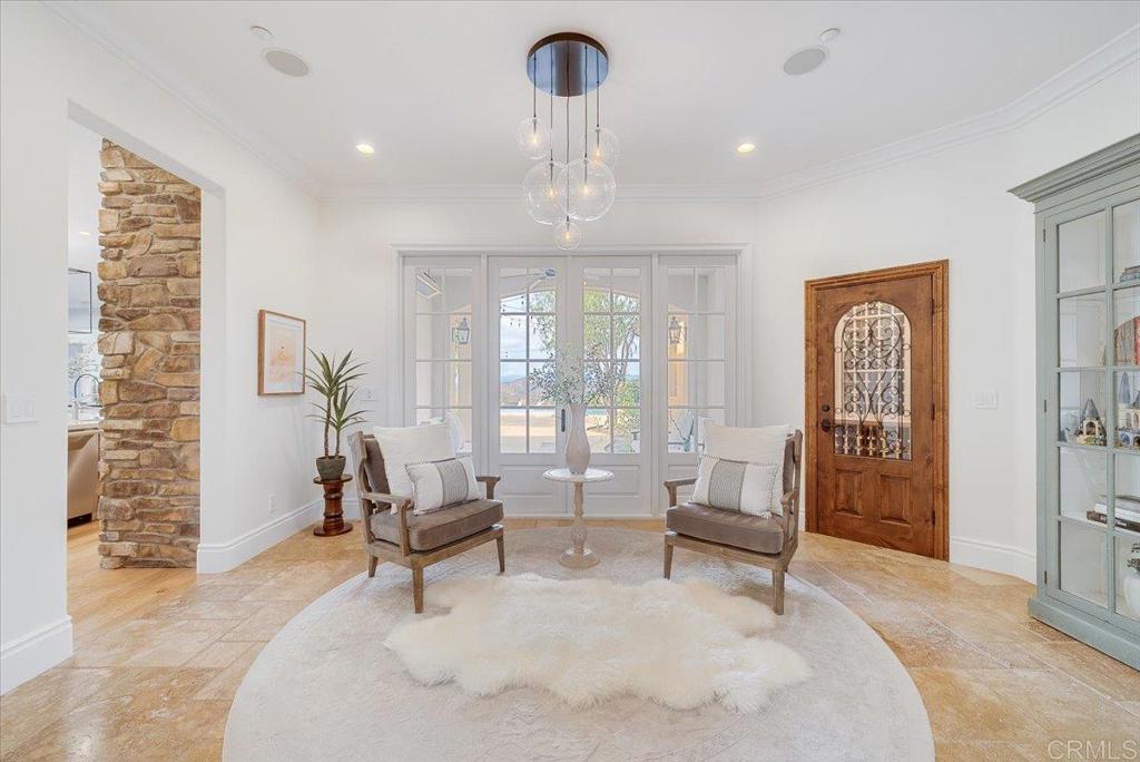 32110 Dos Ninas Bonsall, CA 92003 - Photo 4 of 75 a living room with furniture and a chandelier
