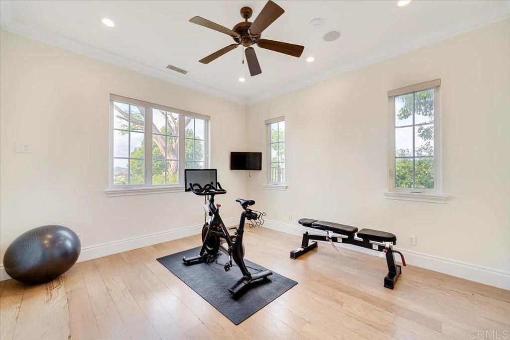 32110 Dos Ninas Bonsall, CA 92003 - Photo 44 of 75 a room with gym equipment and windows