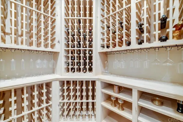 a view of a swimming pool with a patio and fire pit