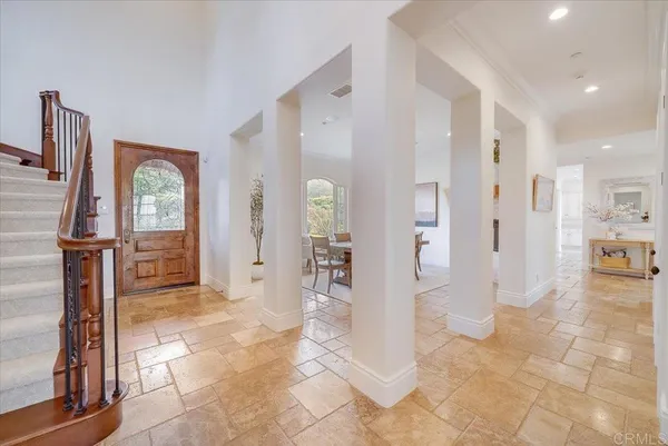 a view of a dining room with furniture window and chandelier