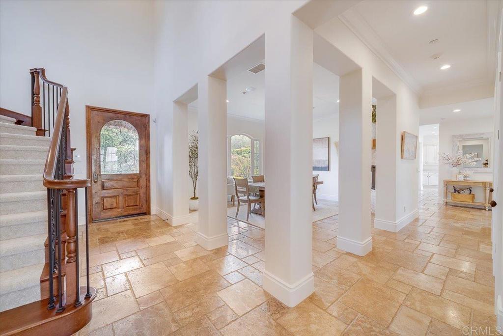 32110 Dos Ninas Bonsall, CA 92003 - Photo 6 of 75 a view of a hallway with wooden floor and a living room