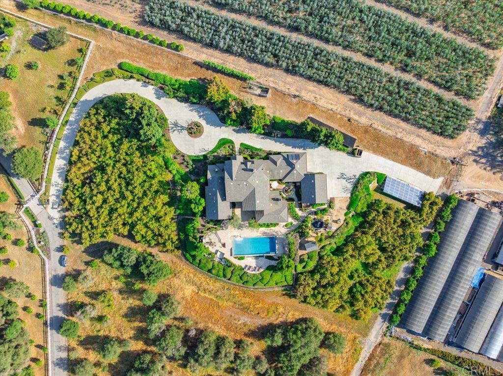 32110 Dos Ninas Bonsall, CA 92003 - Photo 63 of 75 an aerial view of a house with a garden