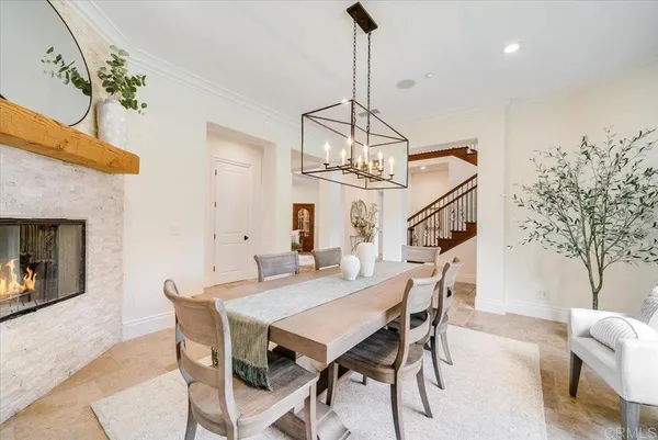 a large kitchen with stainless steel appliances granite countertop a stove a sink dishwasher and cabinets with wooden floor