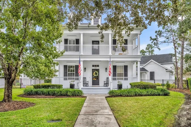 a view of a chair and tables in the balcony