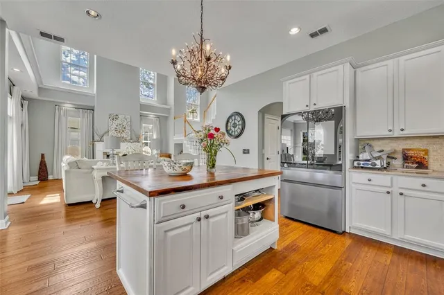 a bedroom with a bed and large window with view of bedroom