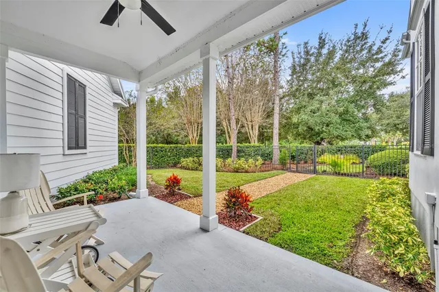 a spacious bedroom with a bed and large windows