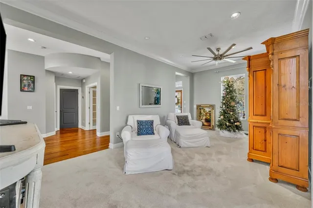 a bedroom with a bed and a flat tv screen on the dresser