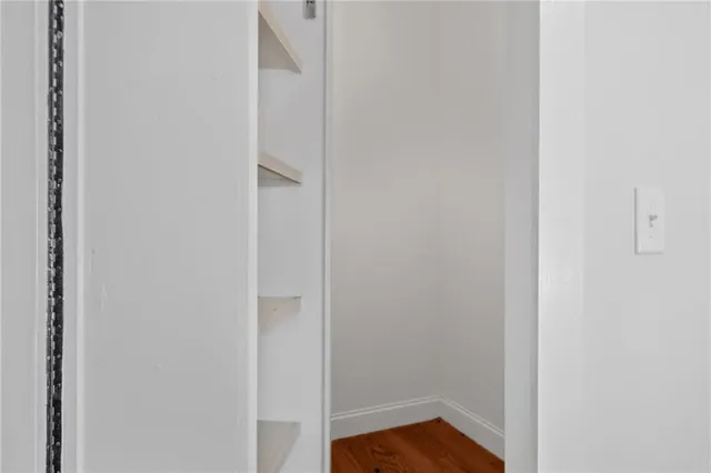 a bathroom with a shower and a sink