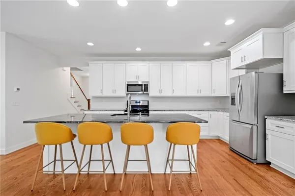 a view of livingroom with furniture window and wooden floor