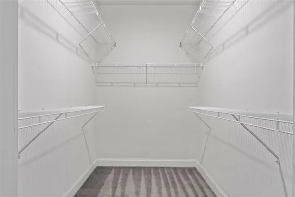 an empty room with windows and garden