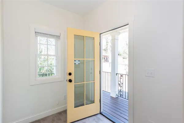a bathroom with a bathtub shower sink vanity mirror and toilet