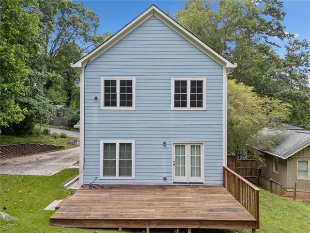 a view of outdoor space with swimming pool and trees in the background