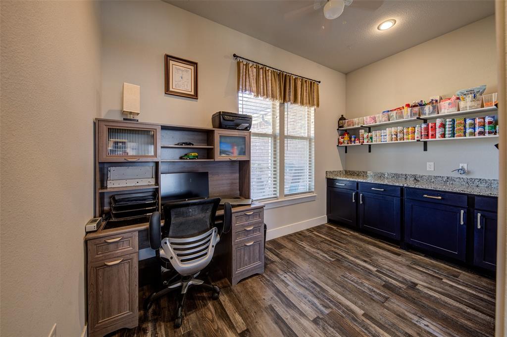 133 Sunset Bay Pointe Court Chico, TX 76431 - Photo 13 of 40 Office area with dark wood-style flooring, a ceiling fan, and baseboards
