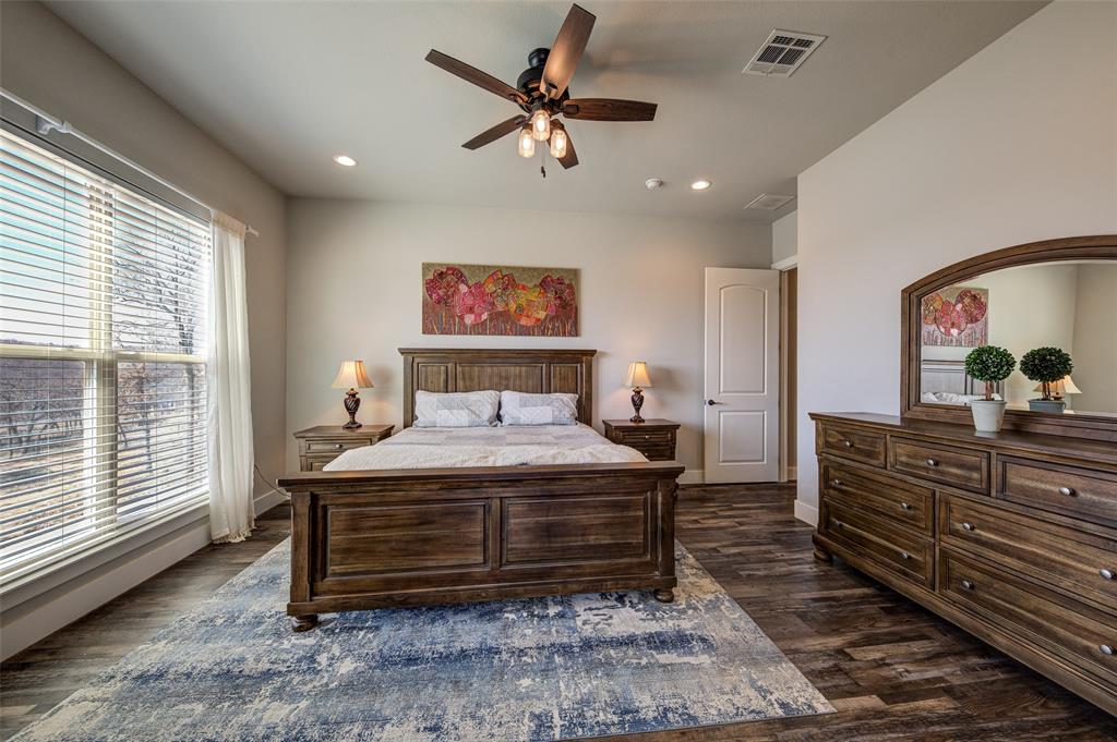 133 Sunset Bay Pointe Court Chico, TX 76431 - Photo 16 of 40 Bedroom featuring visible vents, dark wood finished floors, a ceiling fan, and recessed lighting