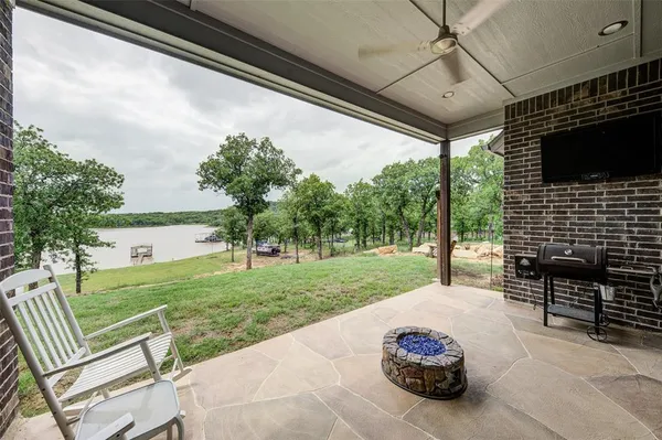 a view of a two chairs in the patio