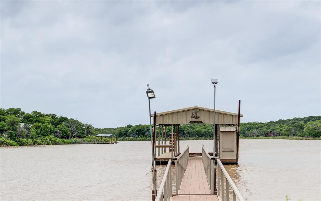 133 Sunset Bay Pointe Court Chico, TX 76431 - Photo 30 of 40 Dock area with a water view