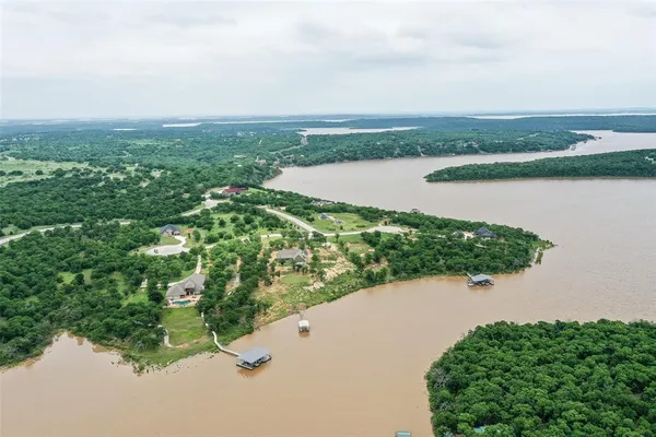 an aerial view of valley and lake