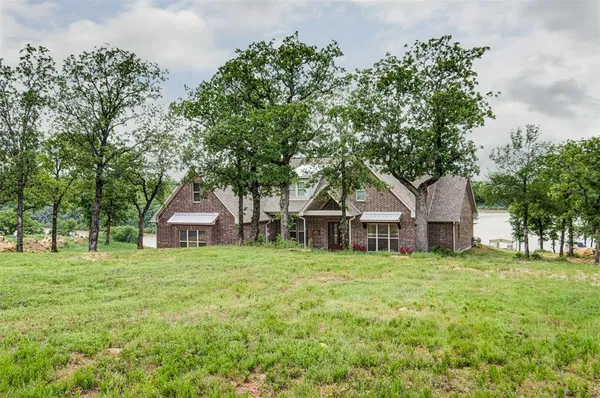a house with a tree in front of the house