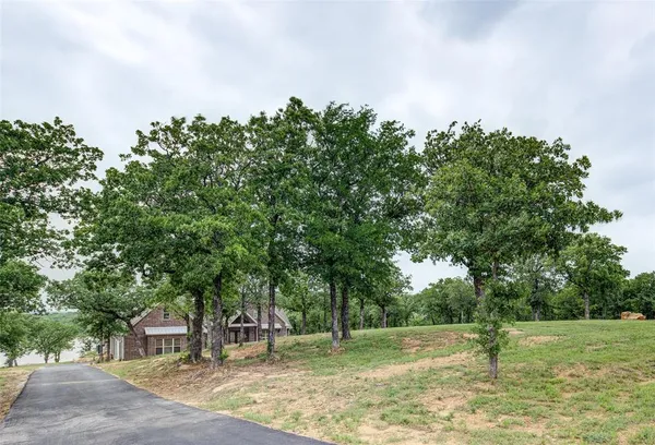 a backyard of a house with lots of green space