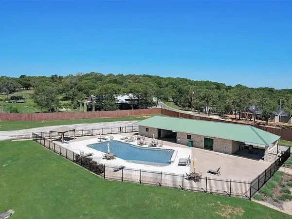 a view of a patio with couches under an umbrella