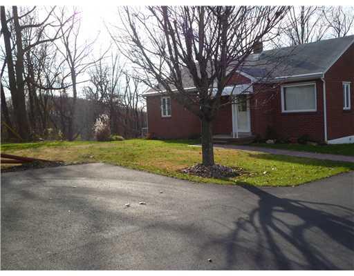Exterior Front. Another view of the home, winter time... notice the paved driveway and paver sidewalk...