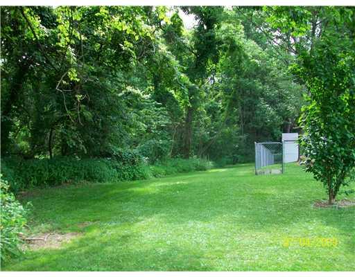 Exterior Back. A shot with the woods fully grown in!  NICE!