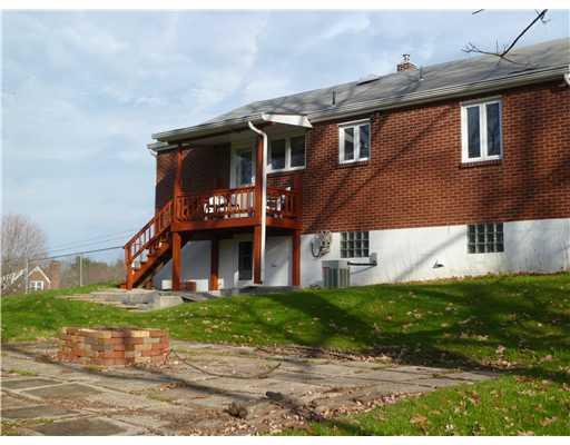 Exterior Back. Fire Pit Area.  Deck comes off the kitchen and is accessible by a door.  Basement is also a walkout!