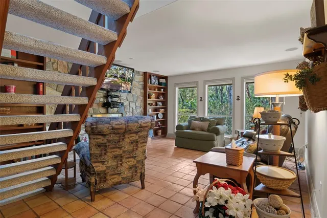 a kitchen with a sink a stove and cabinets
