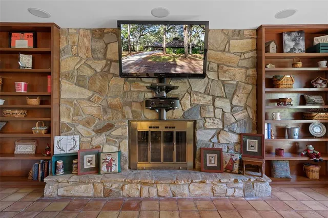a kitchen with granite countertop a sink and white cabinets