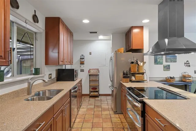 a spacious bedroom with a bed and a large window