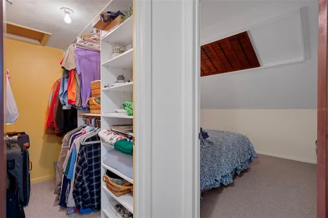 a view of a porch with furniture and a parking space