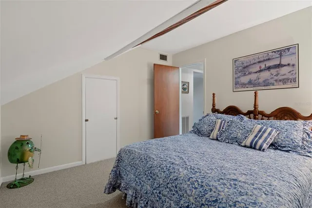 a view of patio with table and chairs and floor to ceiling window