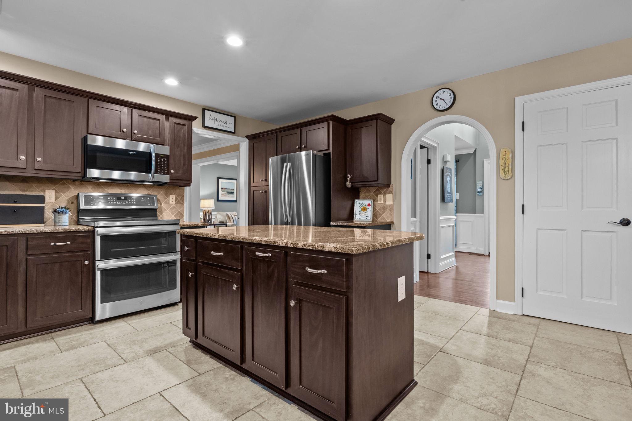121 Beech Drive Hatboro, PA 19040 - Photo 13 of 46 a kitchen with stainless steel appliances granite countertop a refrigerator and a stove top oven