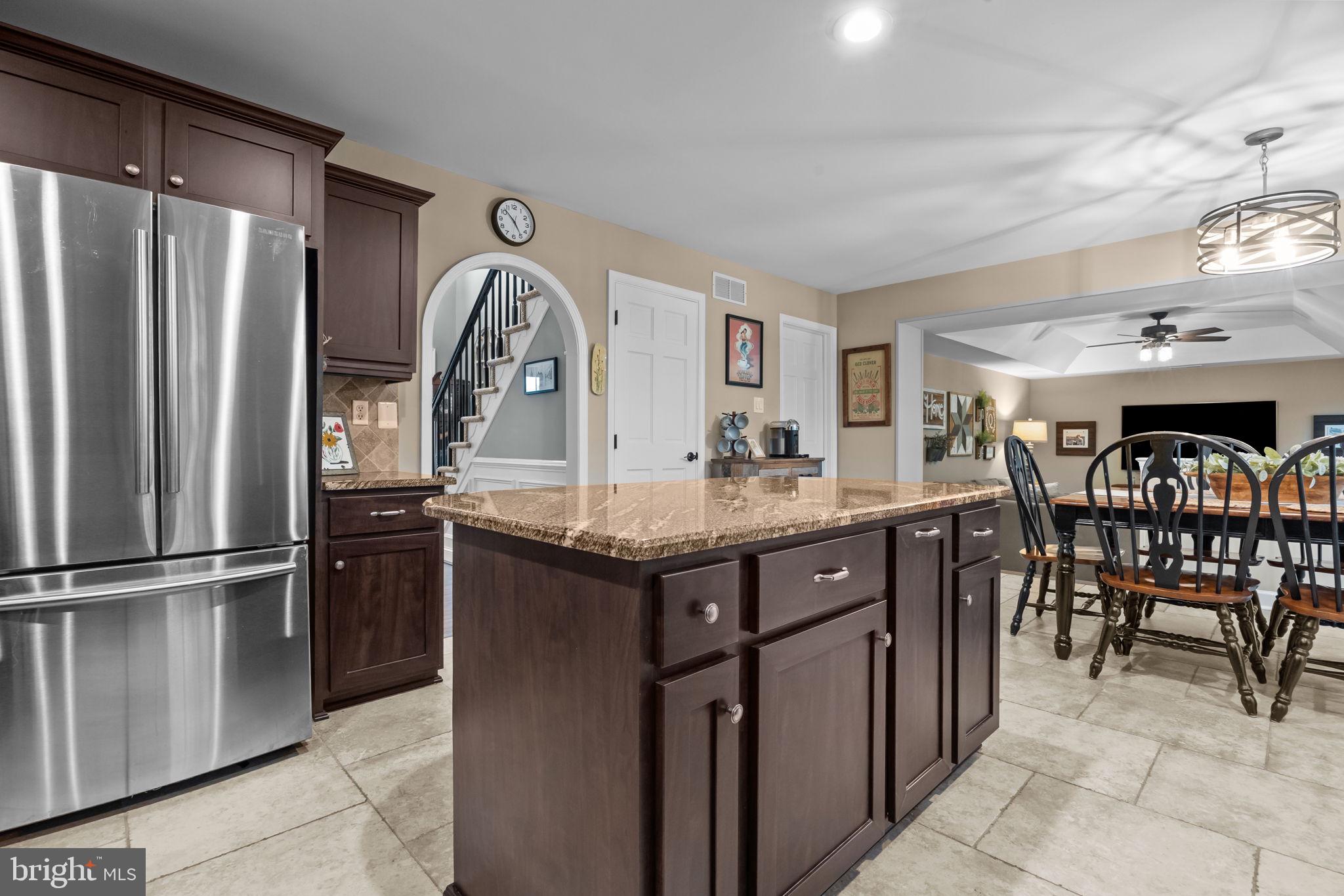 121 Beech Drive Hatboro, PA 19040 - Photo 15 of 46 a kitchen with refrigerator cabinets dining table and chairs