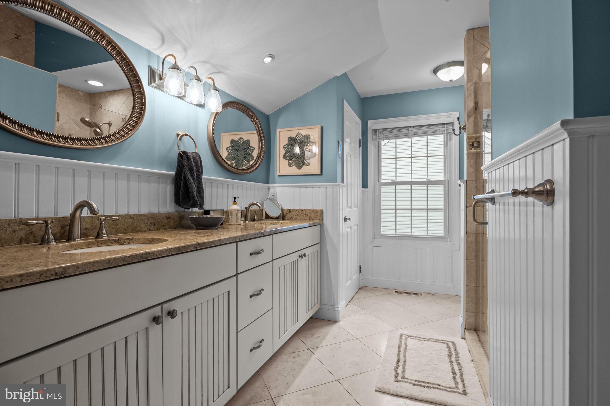 121 Beech Drive Hatboro, PA 19040 - Photo 28 of 46 a bathroom with a double vanity sink and a mirror