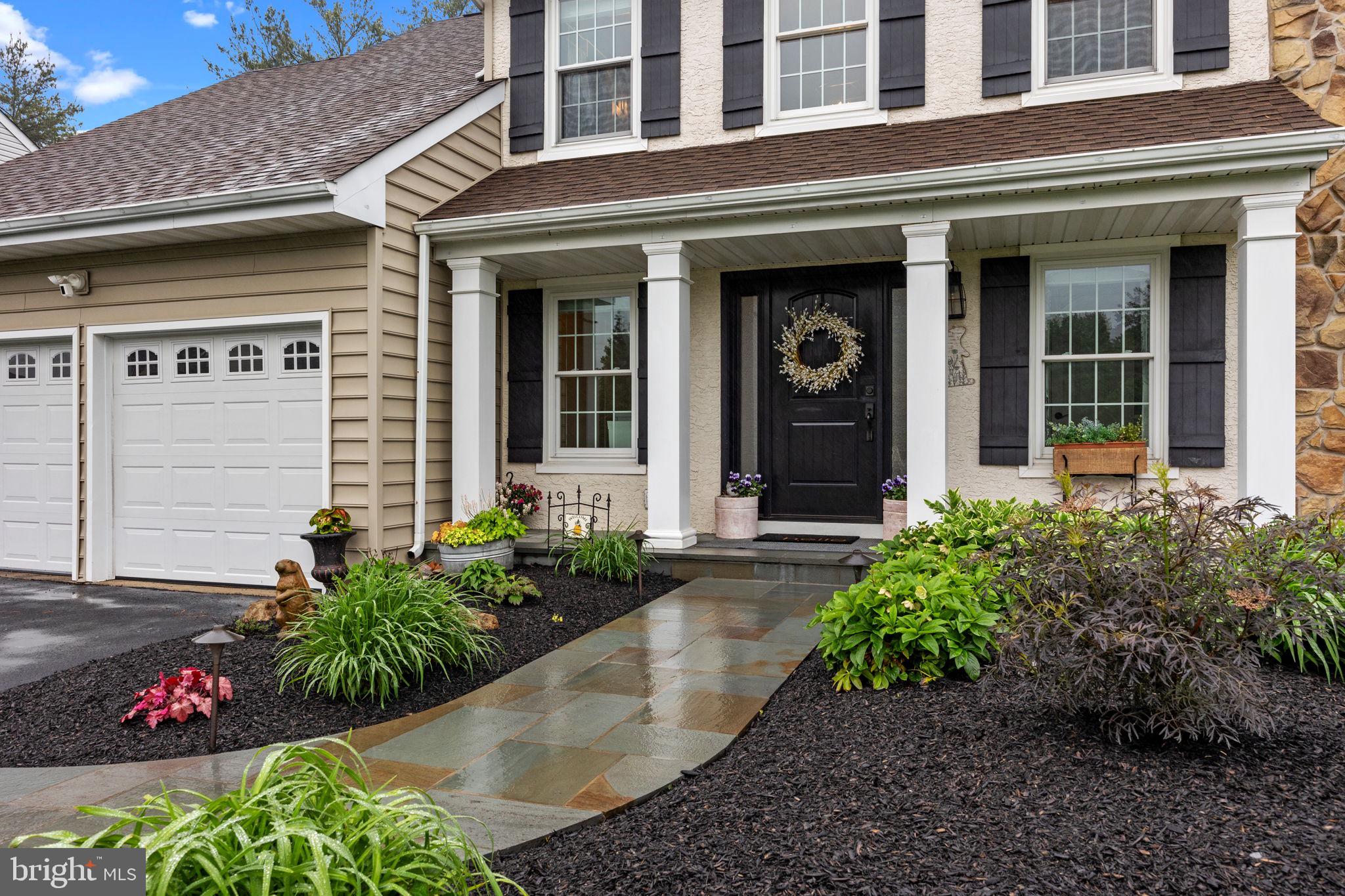 121 Beech Drive Hatboro, PA 19040 - Photo 3 of 46 front view of a brick house with potted plants