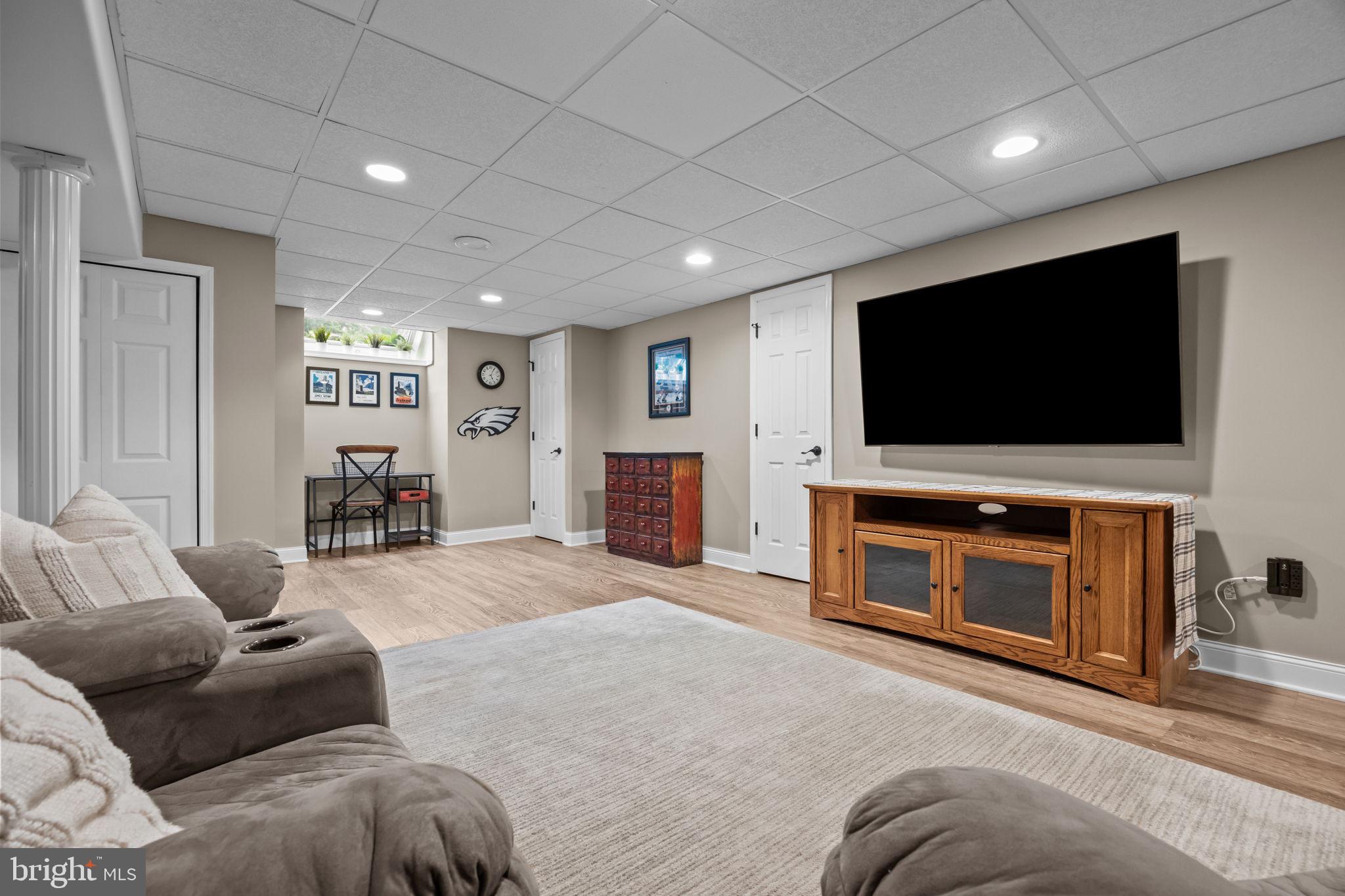 121 Beech Drive Hatboro, PA 19040 - Photo 36 of 46 a living room with furniture and a flat screen tv