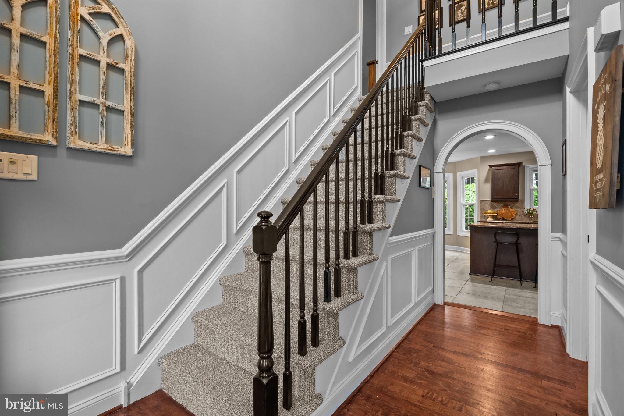 121 Beech Drive Hatboro, PA 19040 - Photo 4 of 46 a view of staircase with lots of frames on wall and wooden floor