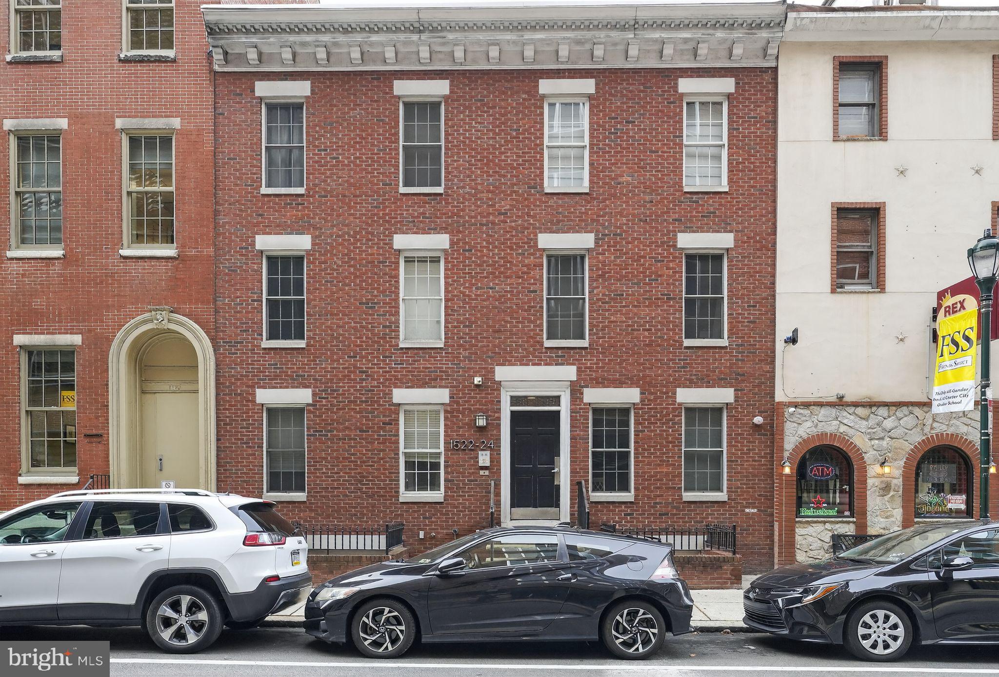 1522 Race Street, Unit 3 Philadelphia, PA 19102 - Photo 15 of 17 a car parked in front of a building