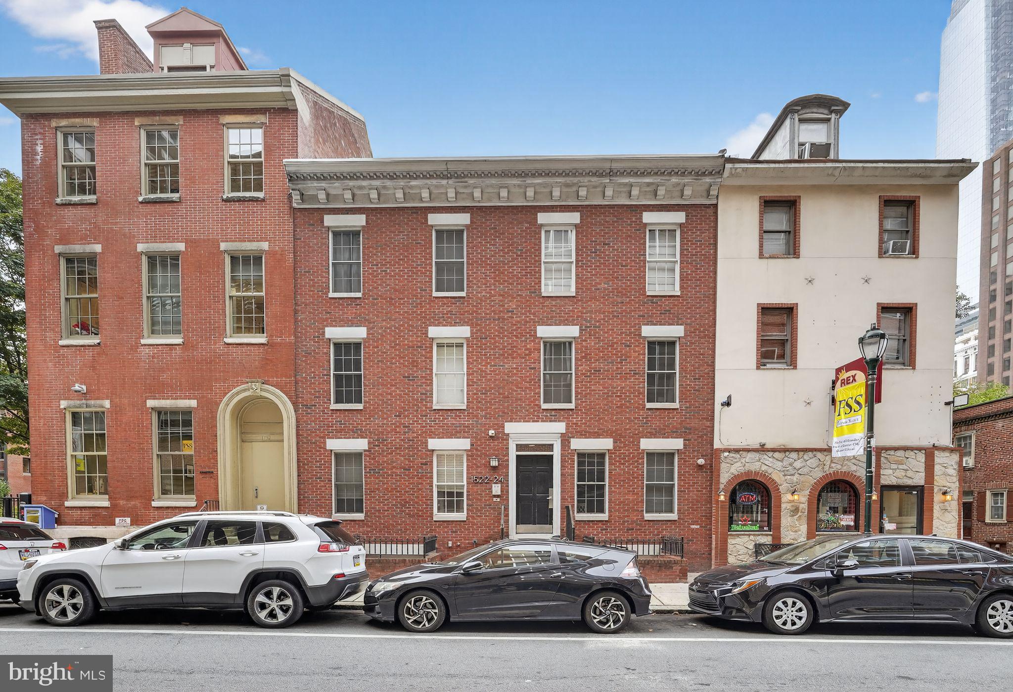 1522 Race Street, Unit 3 Philadelphia, PA 19102 - Photo 16 of 17 a view of a car parked in front of a building