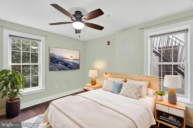 a bedroom with a large bed and a window