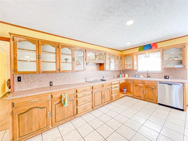 a large kitchen with a large window