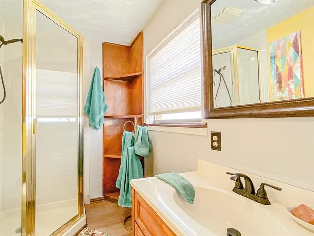 a bathroom with a tub and a sink
